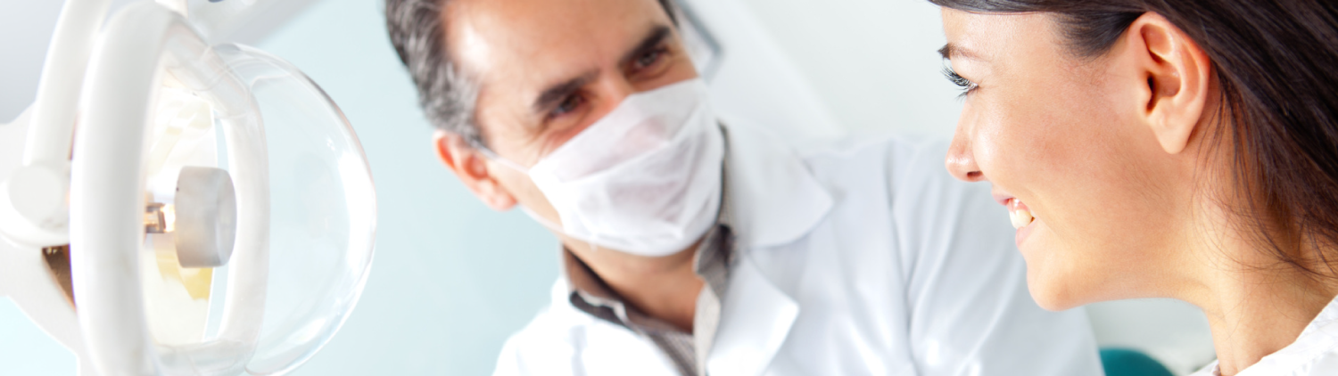 A dentist and patient sharing a relaxed moment during a check-up at Regional Dental Clinic